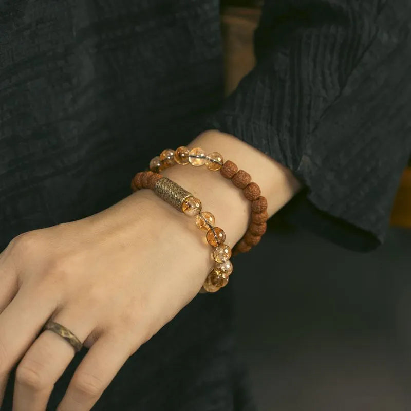 Personalised natural colour LCD double circle bracelet in citrine on a wrist.