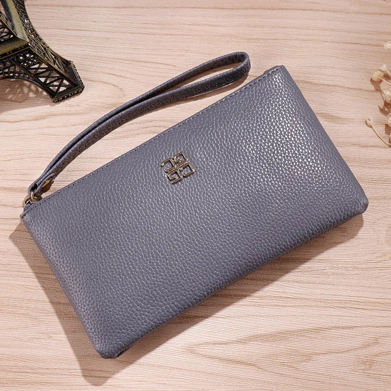Long wine red PU leather cross-body phone wallet handbag with a zip and adjustable strap.