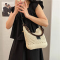 Knitted bucket tote beach bag in black or brown with contrast stitching and crossbody strap