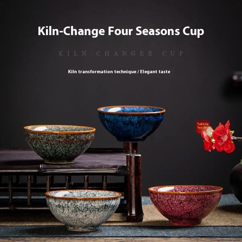 Ceramic Kung Fu tea cup set with four cups in a light-coloured new Chinese style gift box.