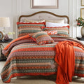 Pure cotton bedspread and pillowcase set in a patterned design on a bed.