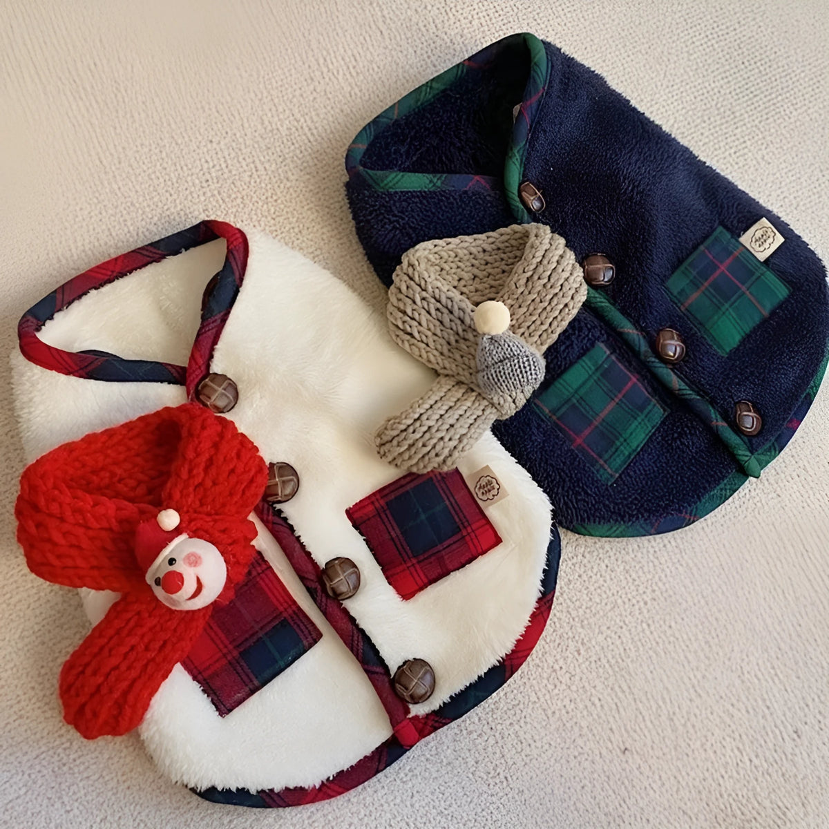 Navy blue pet fleece jacket with checkered pattern, Sherpa lining, decorative buttons, and snowman accent on a small dog