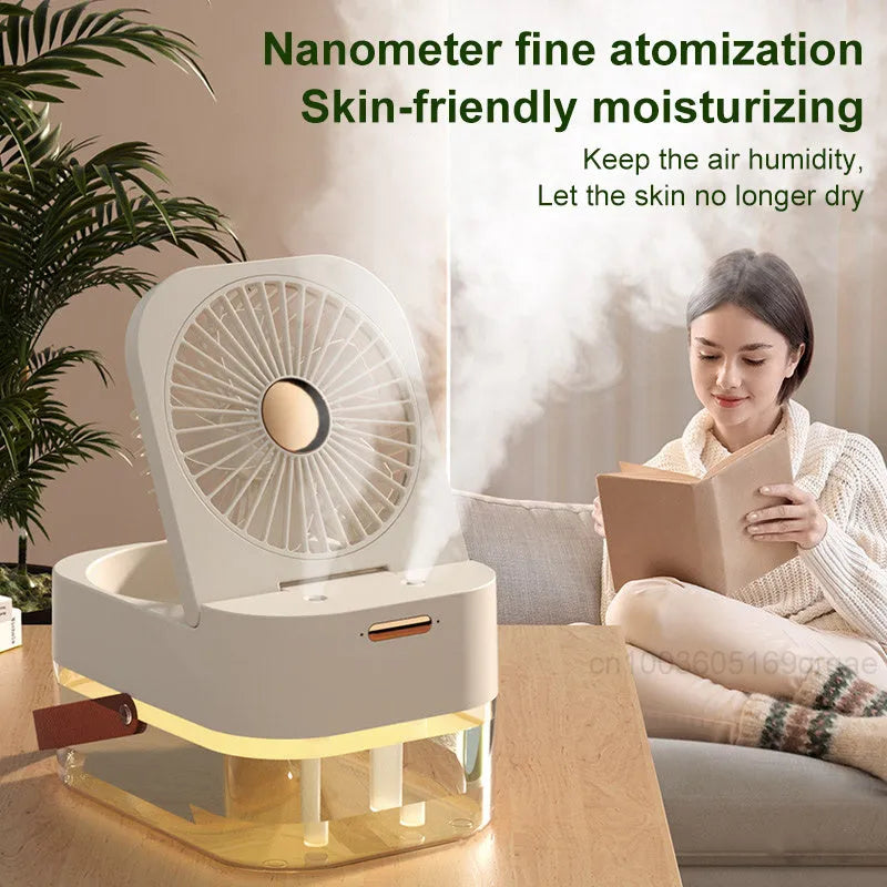 White or green USB desktop fan humidifier with remote control on a wooden desk.