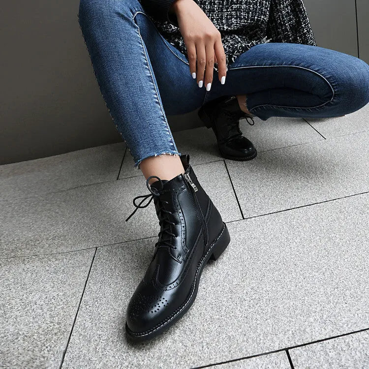 Women's black classic boots with chunky short stout heel, pointed toe, ethnic totem pattern, and middle calf length