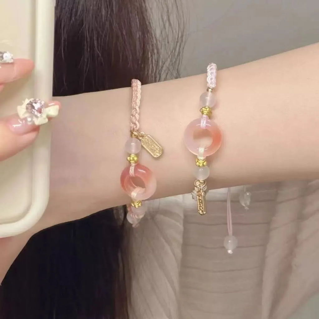 DIY woven watch band with peach blossom patterns in green, pink, and black colour options
