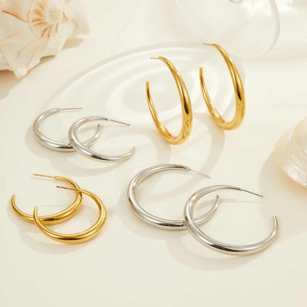 Titanium steel hoop earrings with 18K gold plating in geometric round design