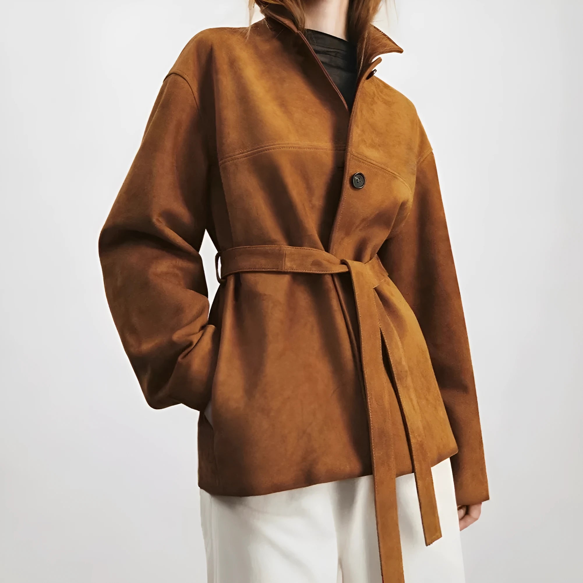 Yellow Brown loose-fit cashmere coat with Peter Pan collar and leather stitching details on front.