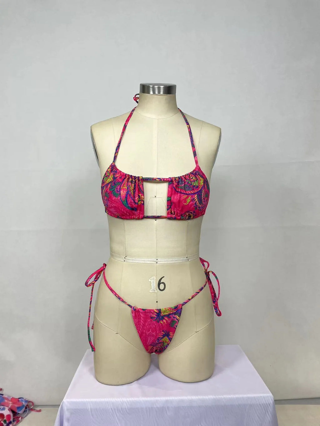 Pink women's two-piece bikini swimsuit set with briefs styling