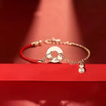 Women's festive koi bracelet with mixed materials, fishtail elements, and peace buckle closure
