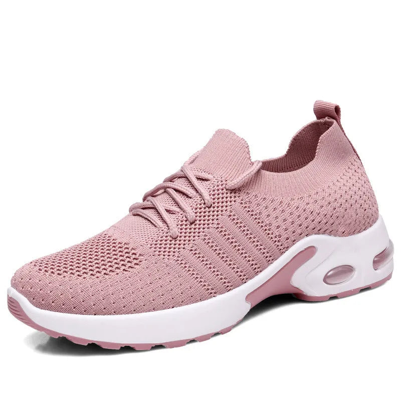 Women's black lace-up casual sneakers with a mesh upper and a textured non-slip PVC sole.