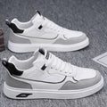 Men's low-top canvas board shoes in grey with leather stitching and mesh lining visible at the collar.