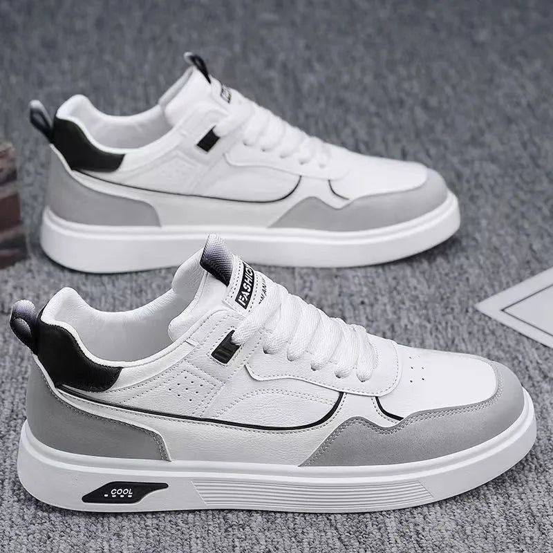 Men's low-top canvas board shoes in grey with leather stitching and mesh lining visible at the collar.