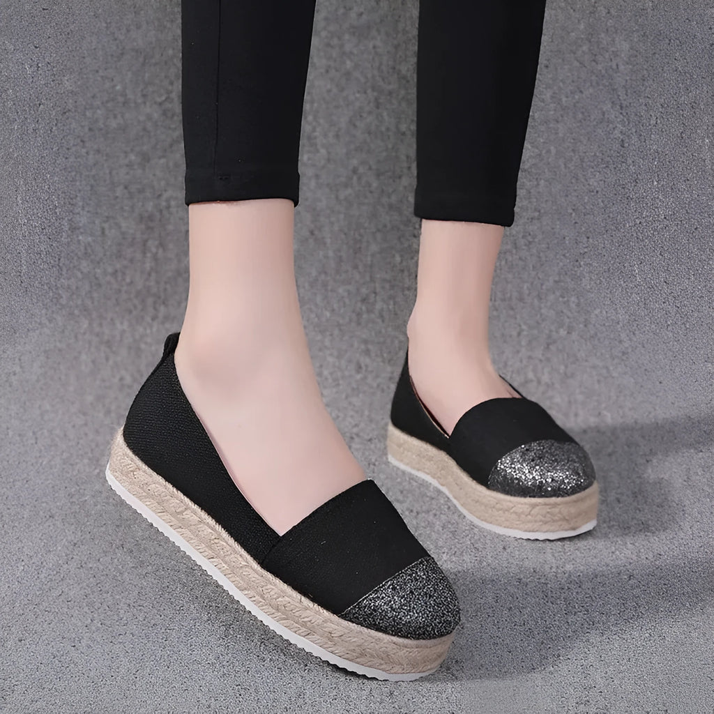 Plus size breathable canvas flat shoes in black and beige with round toe and slip-on design.