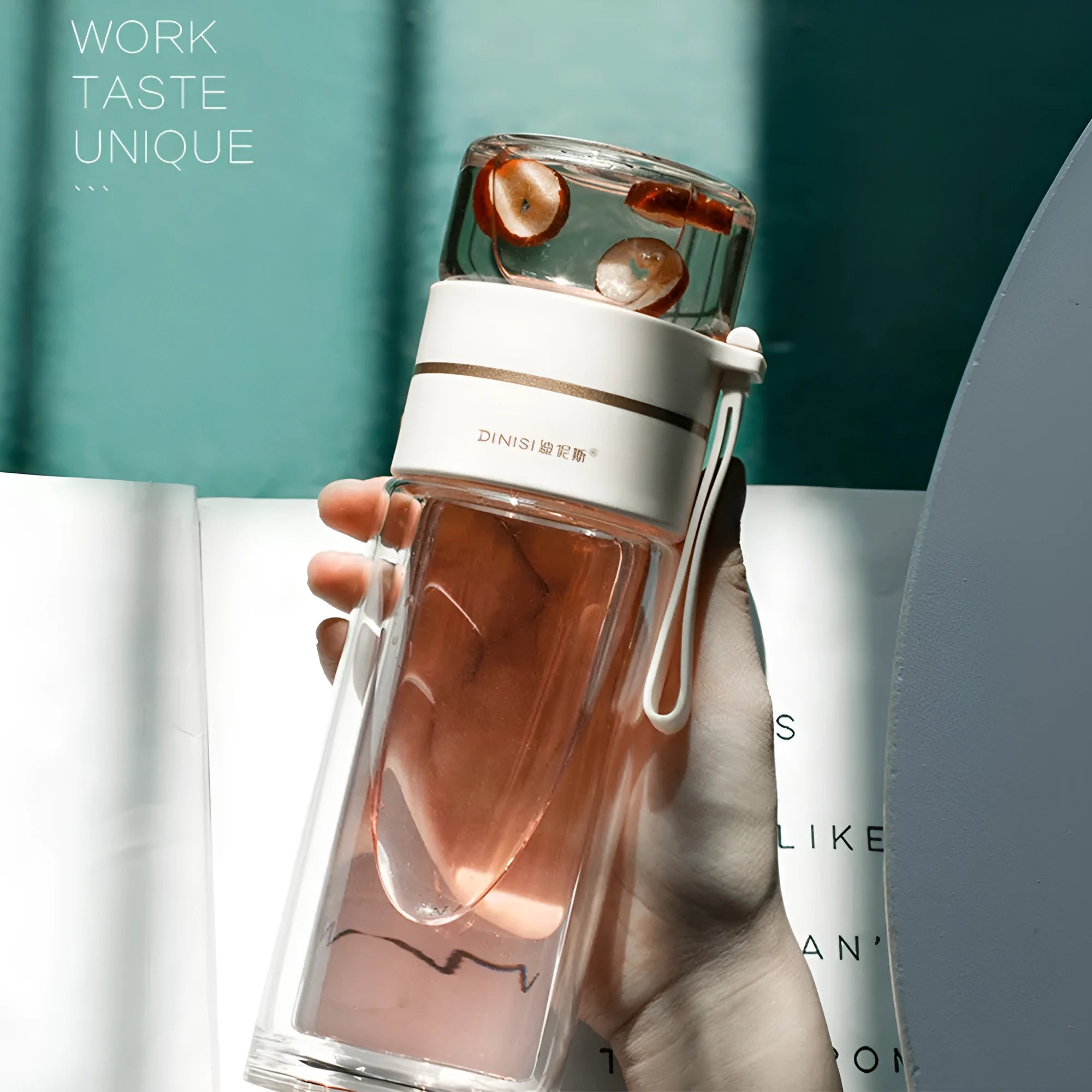 Double-wall glass water bottle with tea infuser insert and rope handle in assorted colours.
