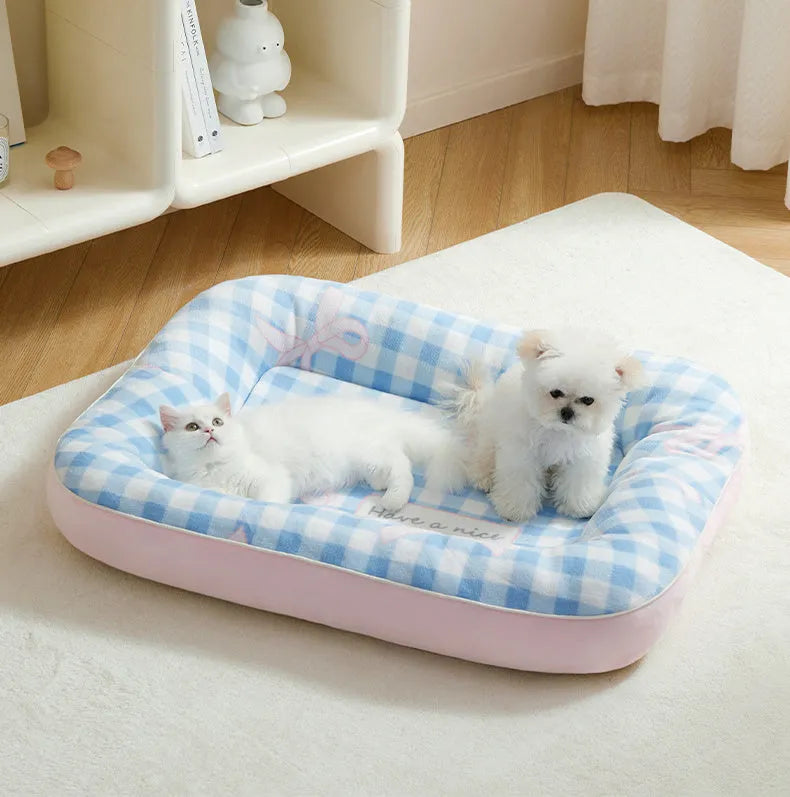 Blue small dog bed cushion with PP cotton fill, size M, on a sofa