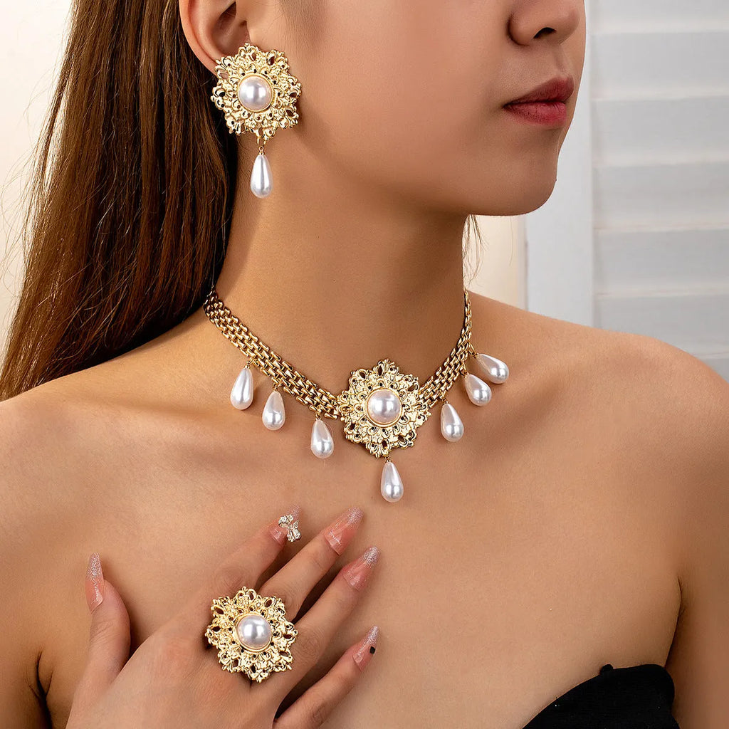 French retro hollow flower pearl tassel jewellery set in white, including necklace, earrings, and ring, alloy material
