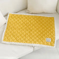 A quilted blue cloth pet blanket for cats, shown in a large size measuring 80 by 60 centimetres.