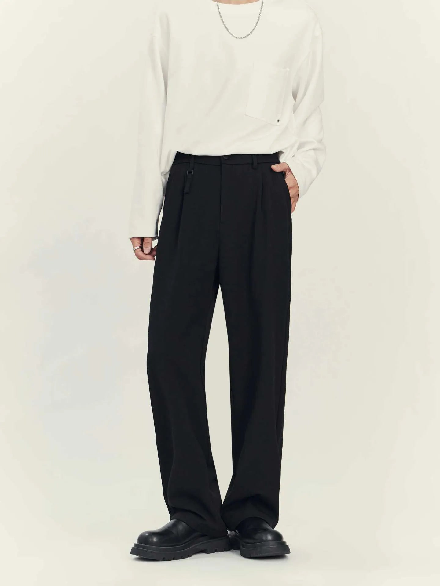 Man's loose-fit straight-leg business casual trousers in grey, laid flat showing waistband and full length.