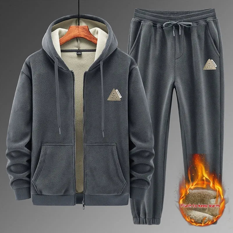 Grey cashmere-blend hooded sweater and matching trousers laid flat as a casual sports suit set.