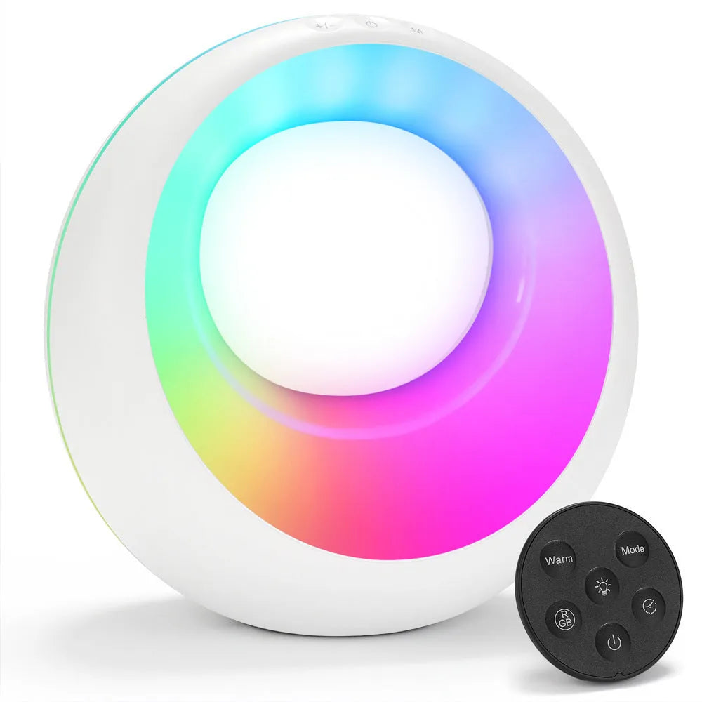 Small RGB colour changing desk lamp with remote control on wooden surface