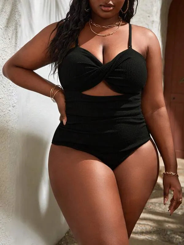 Black plus size women's slimming one-piece swimsuit with sleeveless triangle style design