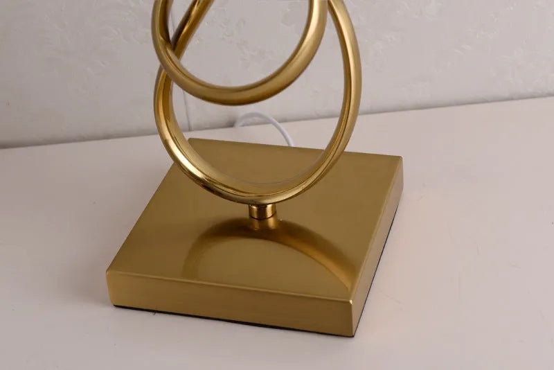 Creative bedside lamp with electroplating imitation copper finish, white colour, on a bedside table with button switch and UK plug