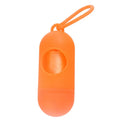 Compact black dog waste bag holder with a metal hook and Velcro strap, shown next to a roll of bags.