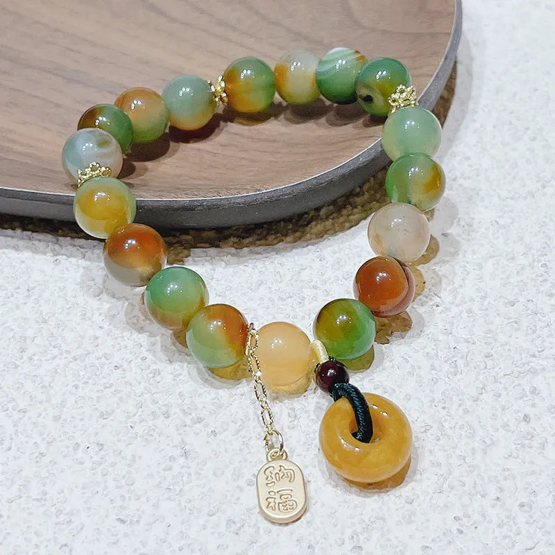 Women's peacock agate and topaz bracelet with a traditional peace buckle clasp.