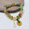 Women's peacock agate and topaz bracelet with a traditional peace buckle clasp.