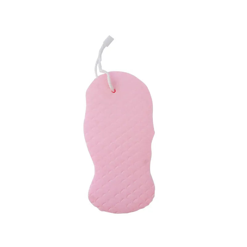 White 3D fish scale pattern bath sponge with hang loop on a bathroom background.