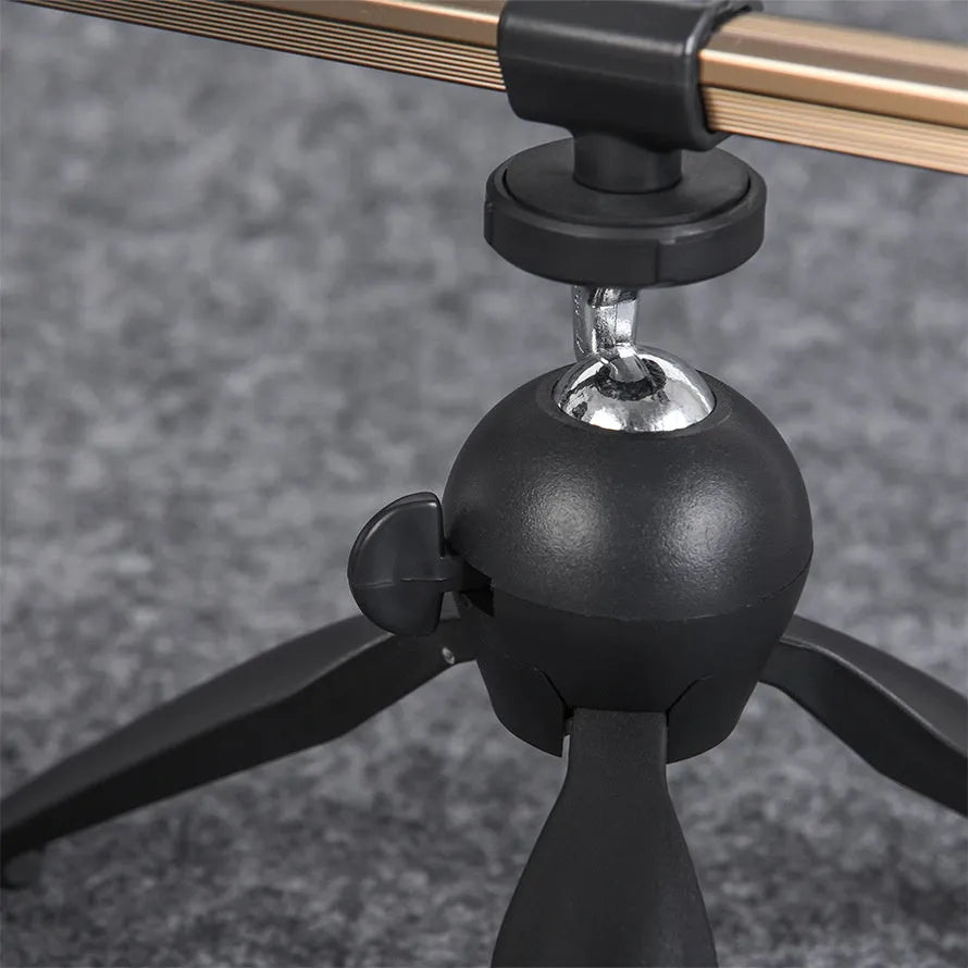 Aluminium alloy ice fishing rod holder bracket in a triangular tripod design on ice.