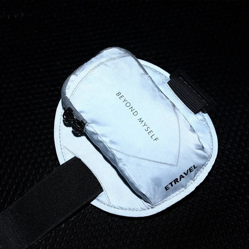 Black reflective running arm bag with adjustable strap, shown holding a mobile phone.