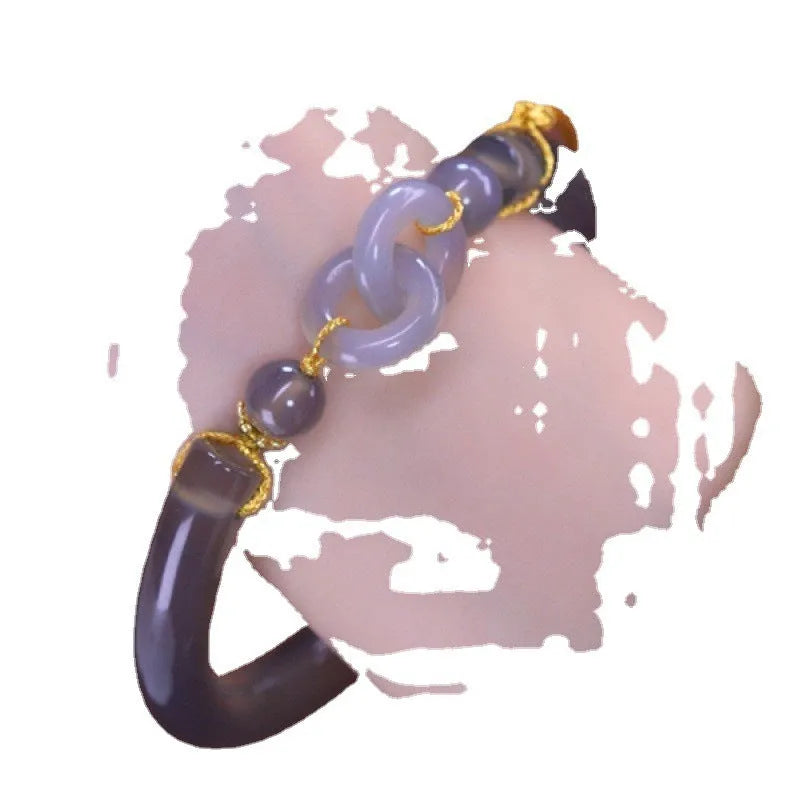 Grey retro-style half bracelet made from smoke purple agate with a visible metal ring buckle closure.