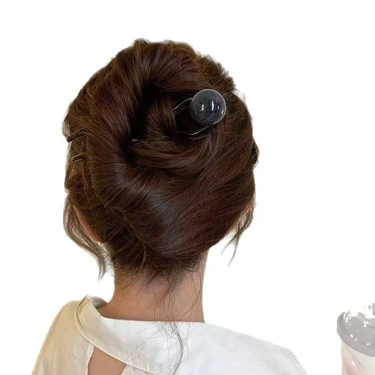 Acrylic U-shaped hair barrette with a retro ball design in a simple style.
