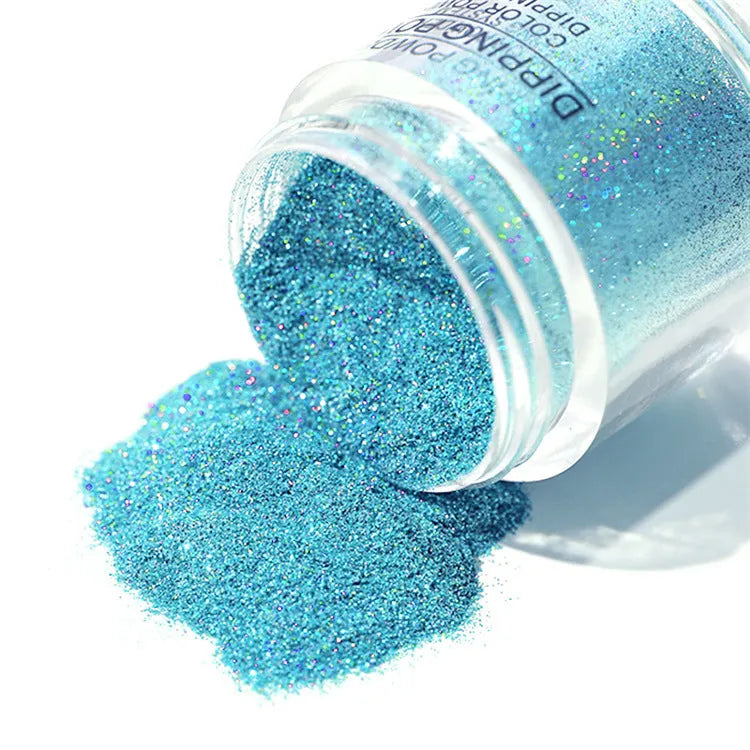 Laser glitter nail powder in a dish with a brush, showing sparkling particles for dip application