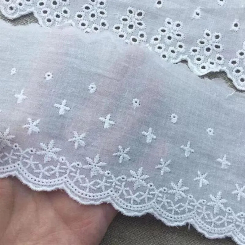 Cotton embroidered lace trim roll showing four different openwork pattern styles for DIY clothing