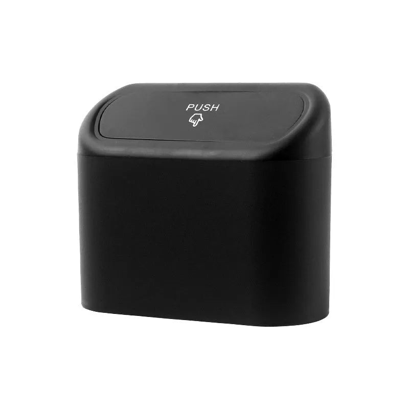 Black plastic folding car trash can placed between vehicle seats.