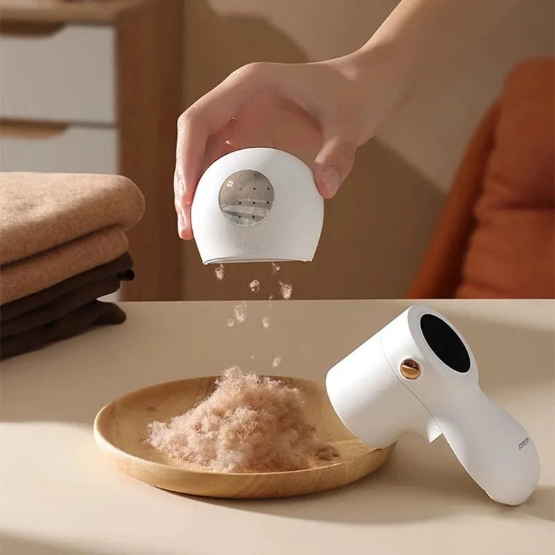 White electric lint remover with LED display and USB charging port for fabric hairball removal