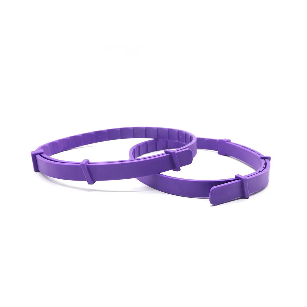 Pack of four solid-colour TPR dog calming collars with buckles, shown in assorted colours.