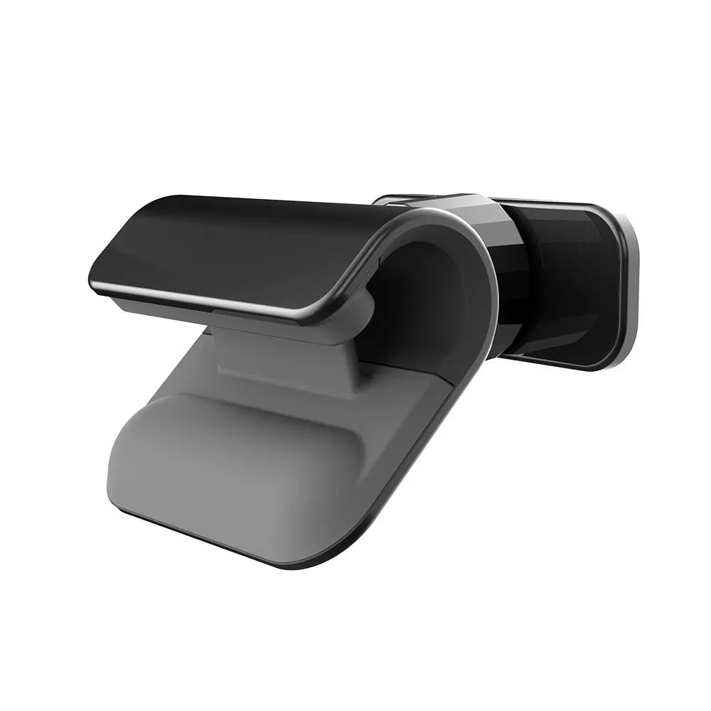 Black universal car phone holder with 360-degree rotating head and adhesive mount on a car dashboard.