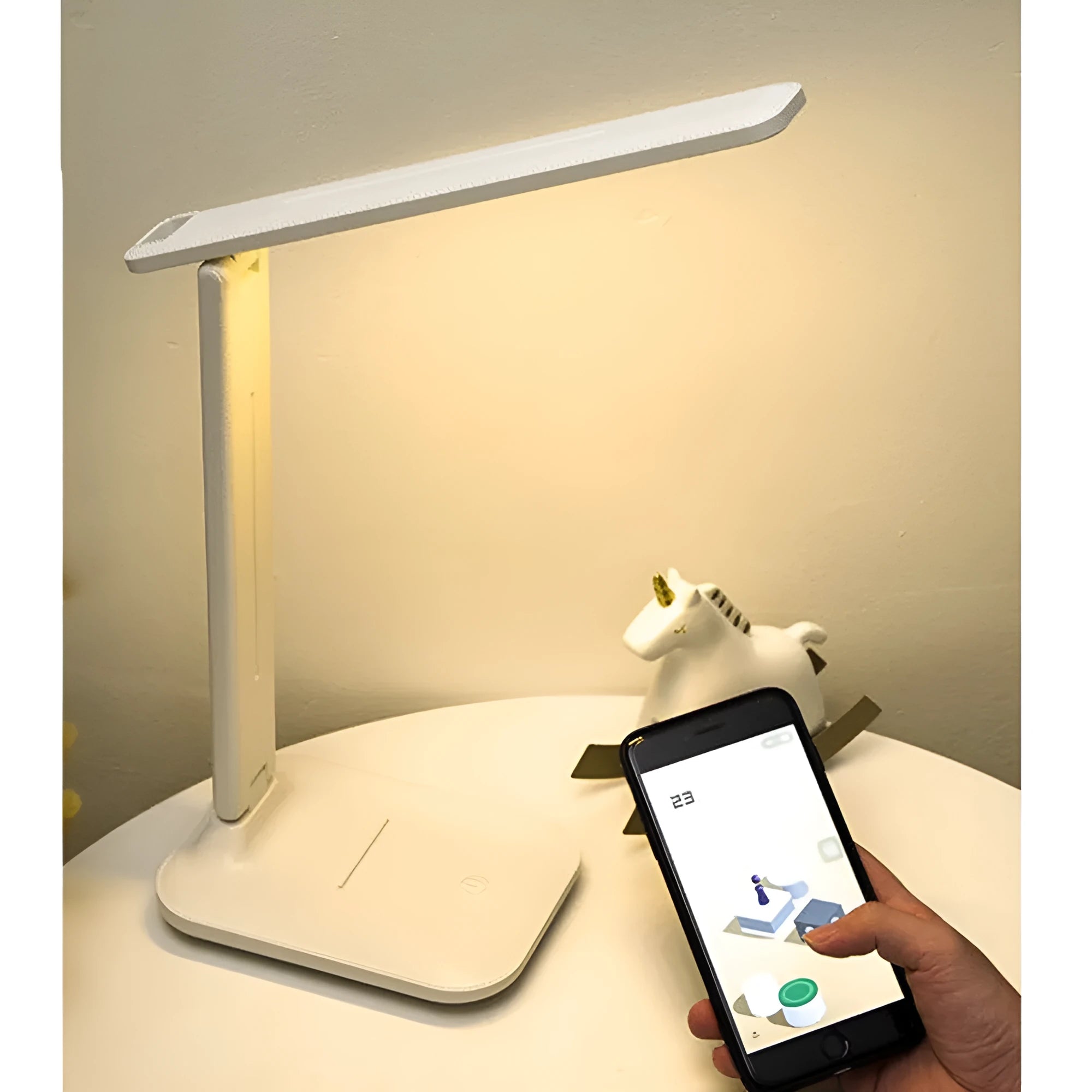 White USB rechargeable bedside lamp with touch dimming controls on a table.