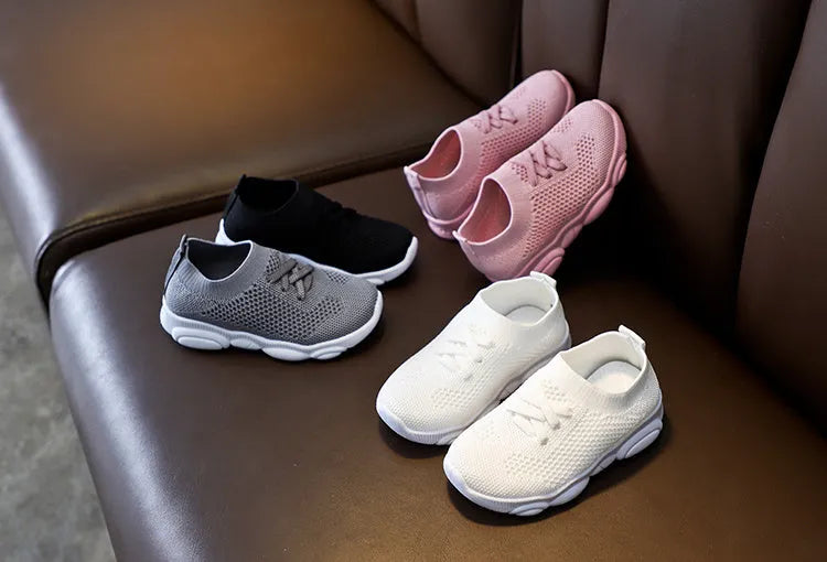 Children's lazy slip-on shoes in fabric with non-slip rubber sole, shown in available colours.