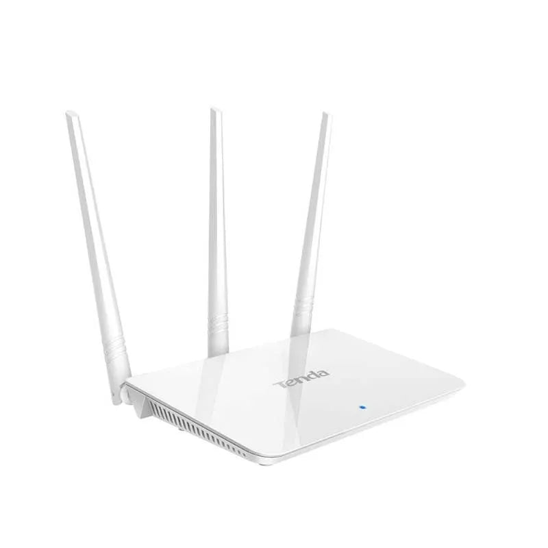 White dual-band wireless broadband router with UK-style three-pin plug on a wooden desk.