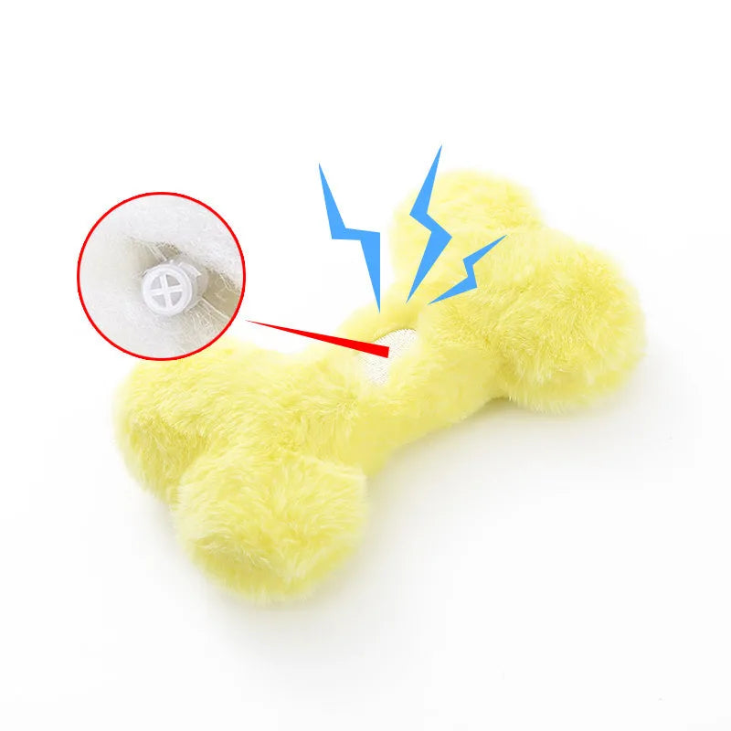 Blue love bone plush dog toy with vocal sound unit and squeaker for interactive chewing play.
