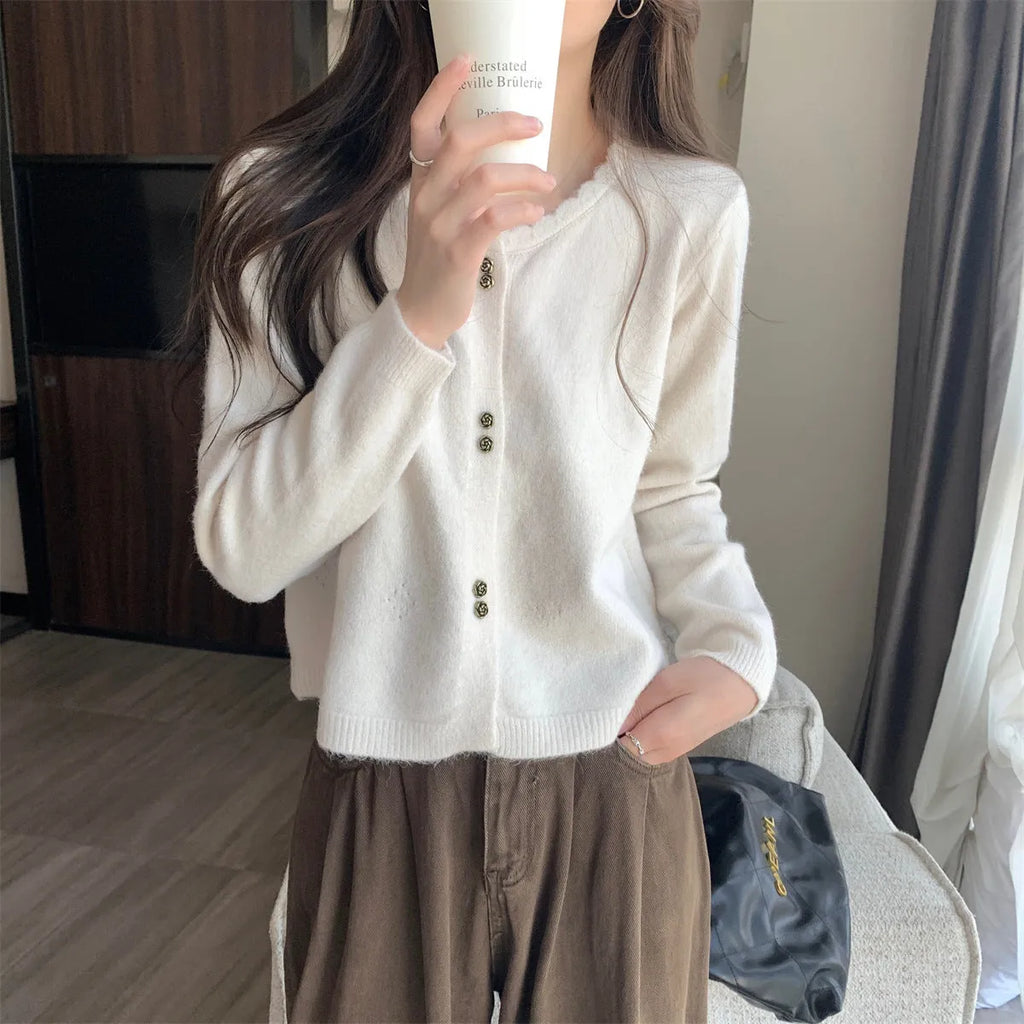 Women's long-sleeved acrylic cardigan coat in light purple, shown with cardigan front open.