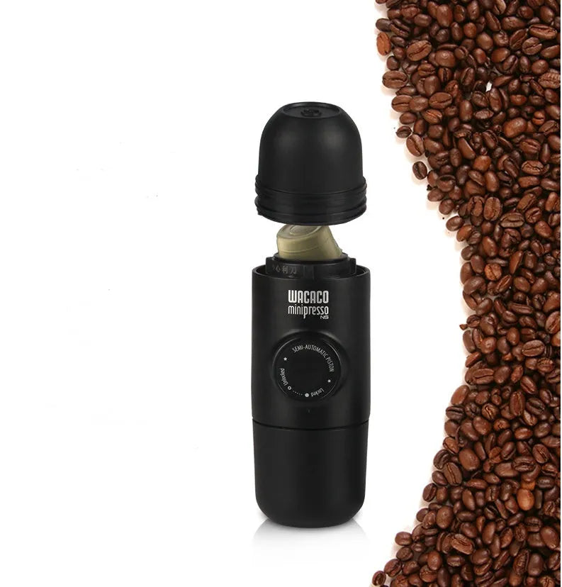 Black portable manual espresso machine showing 6cm diameter and 17.5cm height with stainless steel and plastic components.