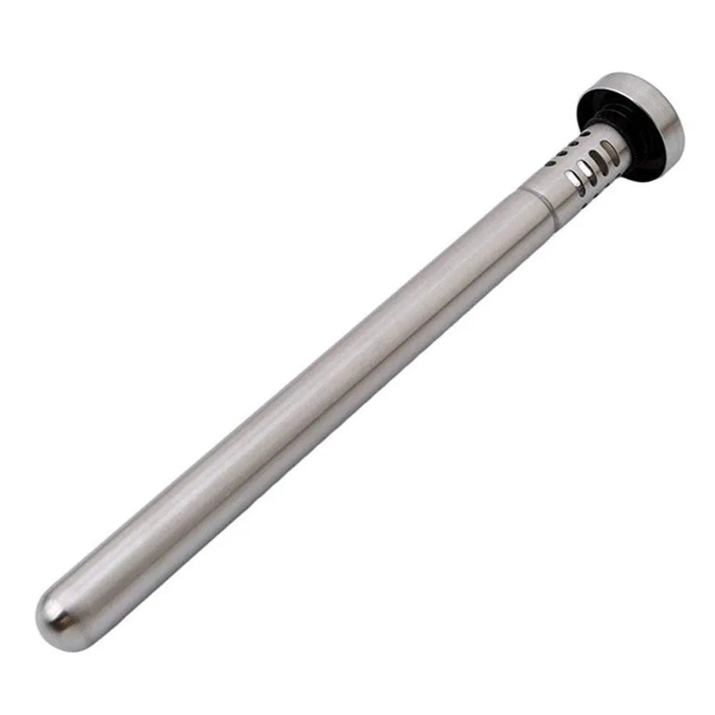 Stainless steel wine cooling rod and pourer in silver, with a bottle of red wine