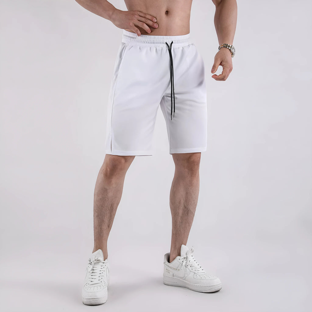 Men's black quick-dry mesh shorts with elastic waistband on a neutral background.
