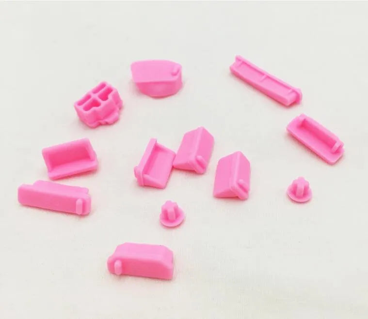 13-piece silicone dust plug set for laptop ports in multiple colours including transparent and black