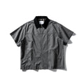 Short sleeve loose cotton overalls shirt in khaki colour on a hanger